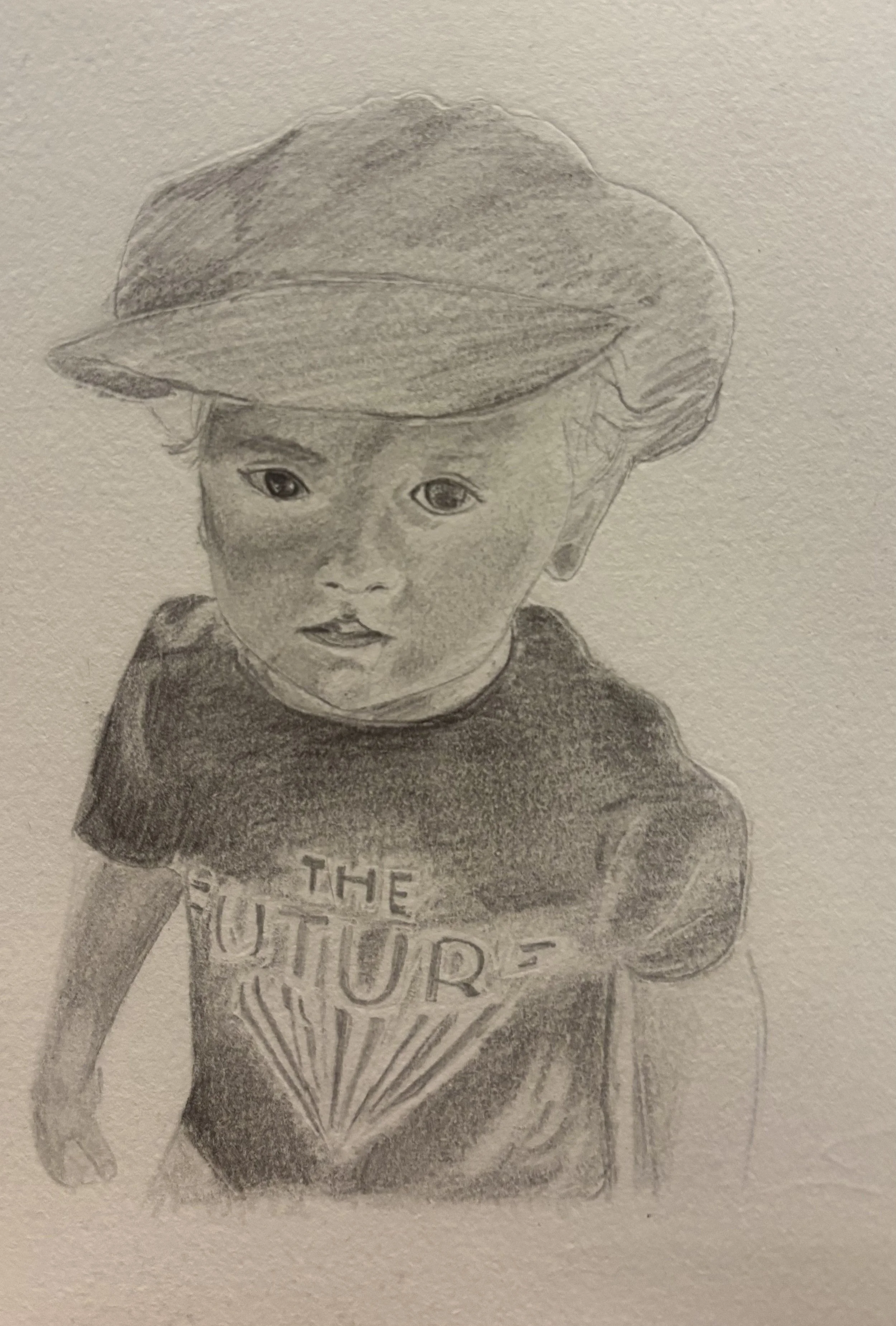 A detailed pencil sketch of a young child wearing a baseball cap and a T-shirt.