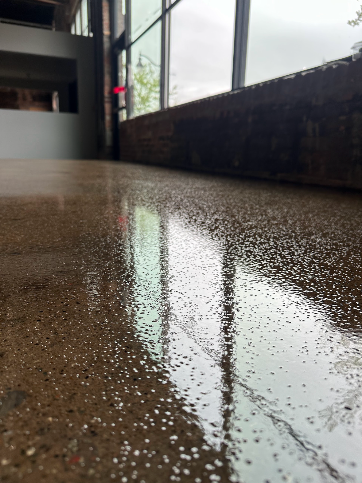 Clear Epoxy flooring with nonslip aluminum oxide inside a storefront 