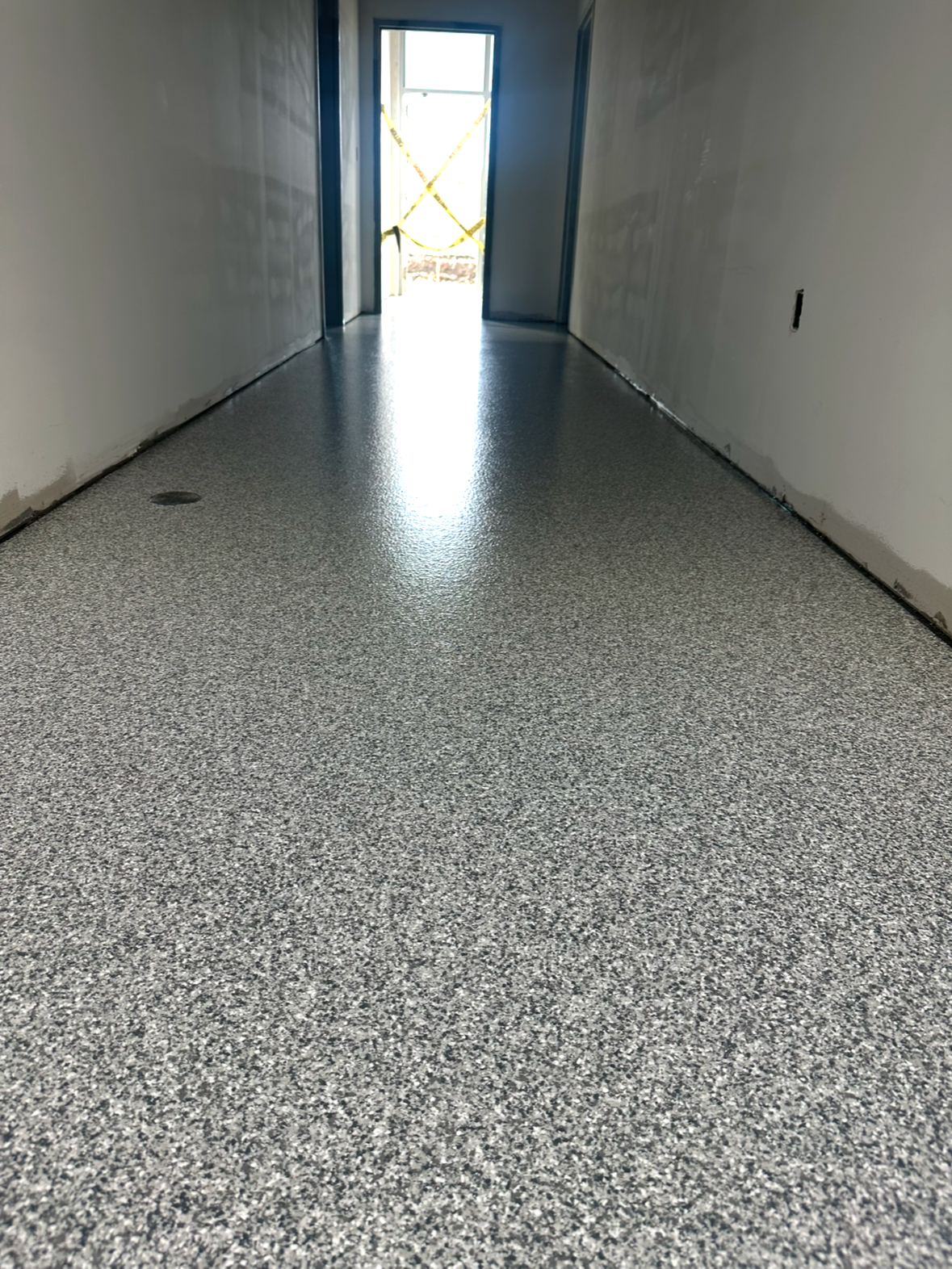 Flake epoxy flooring inside a hallway