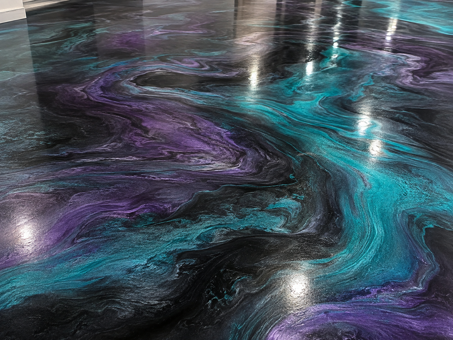 Swirling, abstract marble pattern in shades of purple, blue, teal, black, and gray with glossy finish.