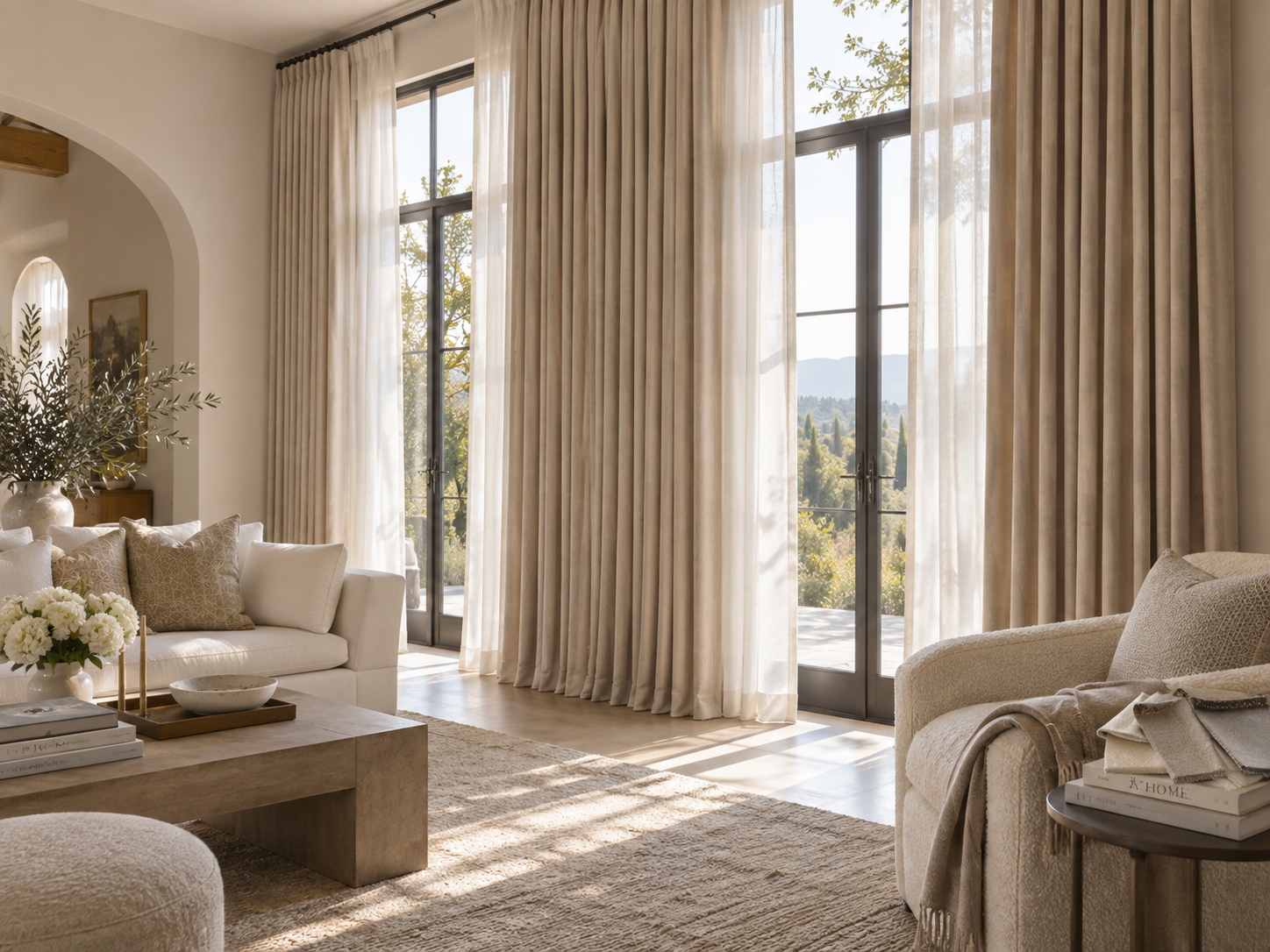 Bright living room with large glass doors, beige curtains, and neutral furnishings.