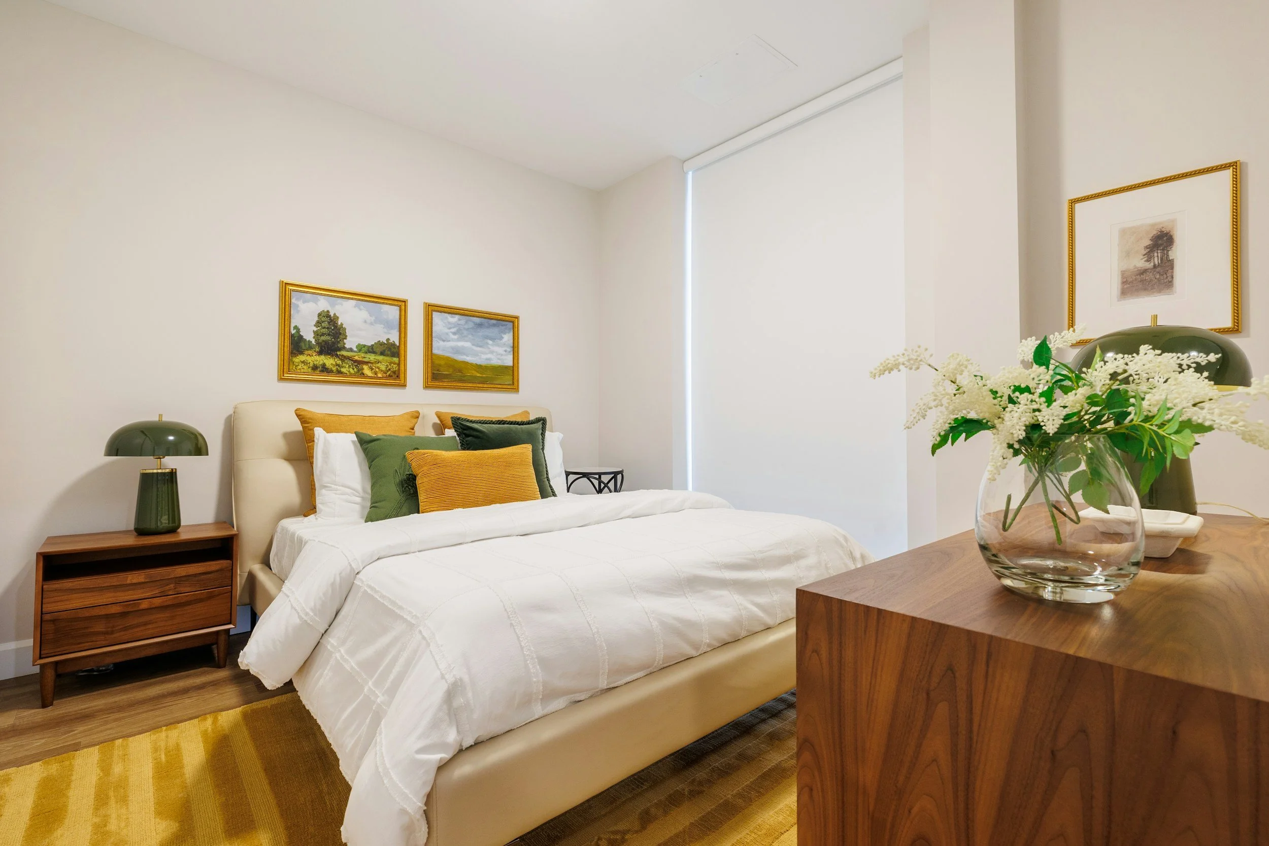 Furnished private bedroom with bed, nightstand, and natural light
