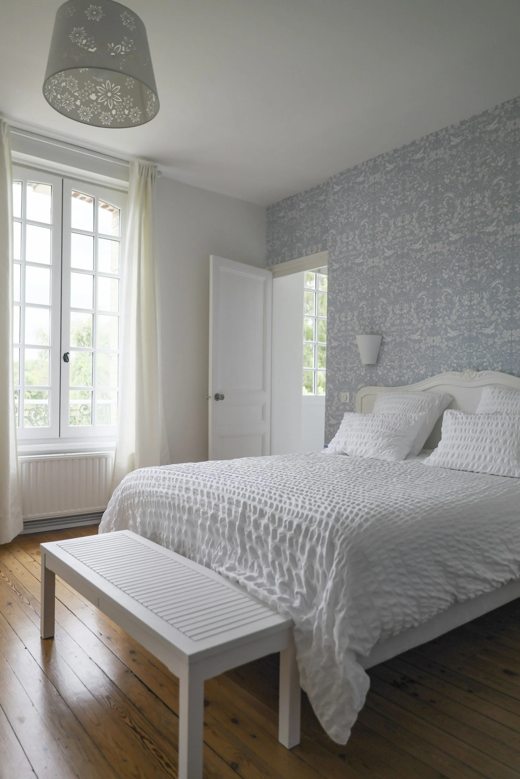 Furnished private bedroom with natural light