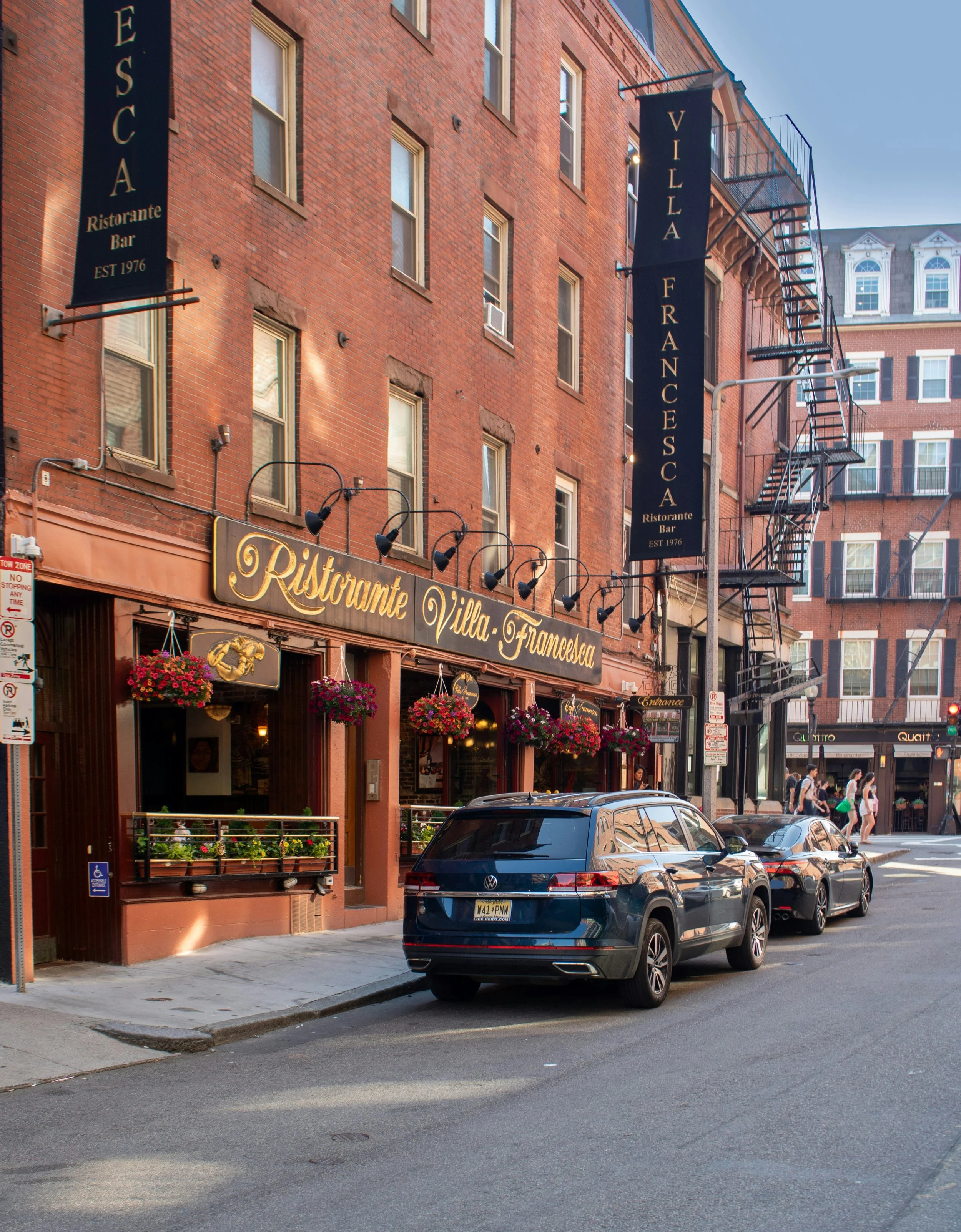 A brick building in Boston's North End neighborhood housing a restaurant called Villa Francesca.