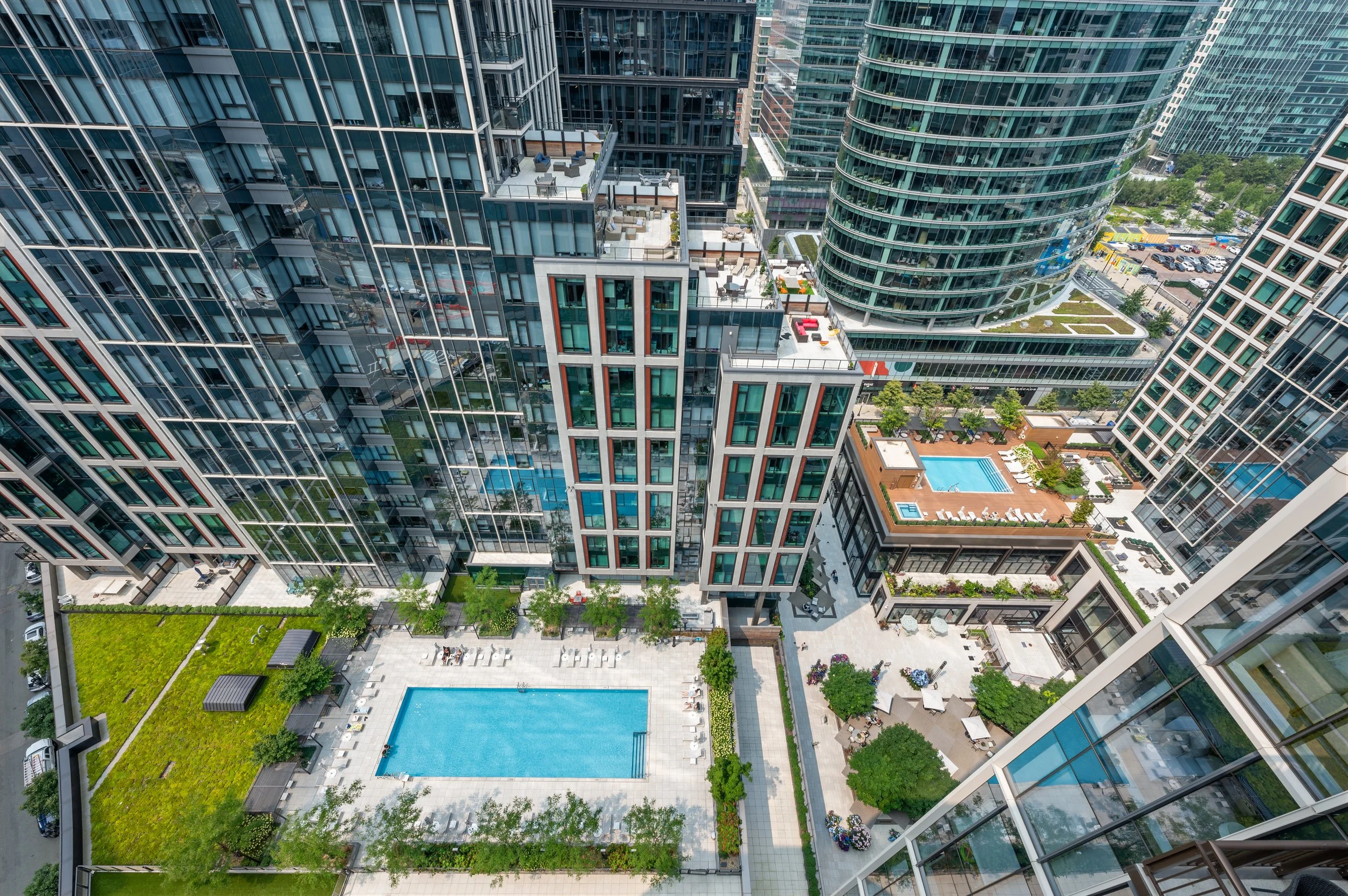 Echelon Seaport District, Boston's rooftop pool, and an outdoor lounge area with seating and greenery.