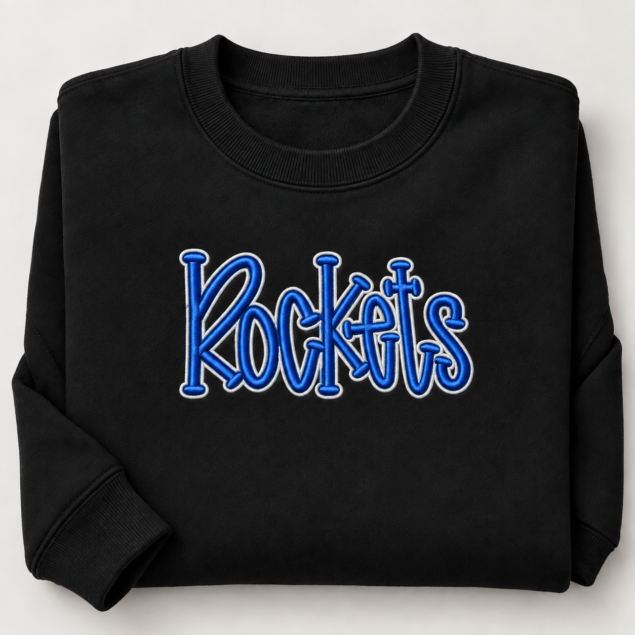 Scaled-down Rockets embroidery on folded black sweatshirt.png