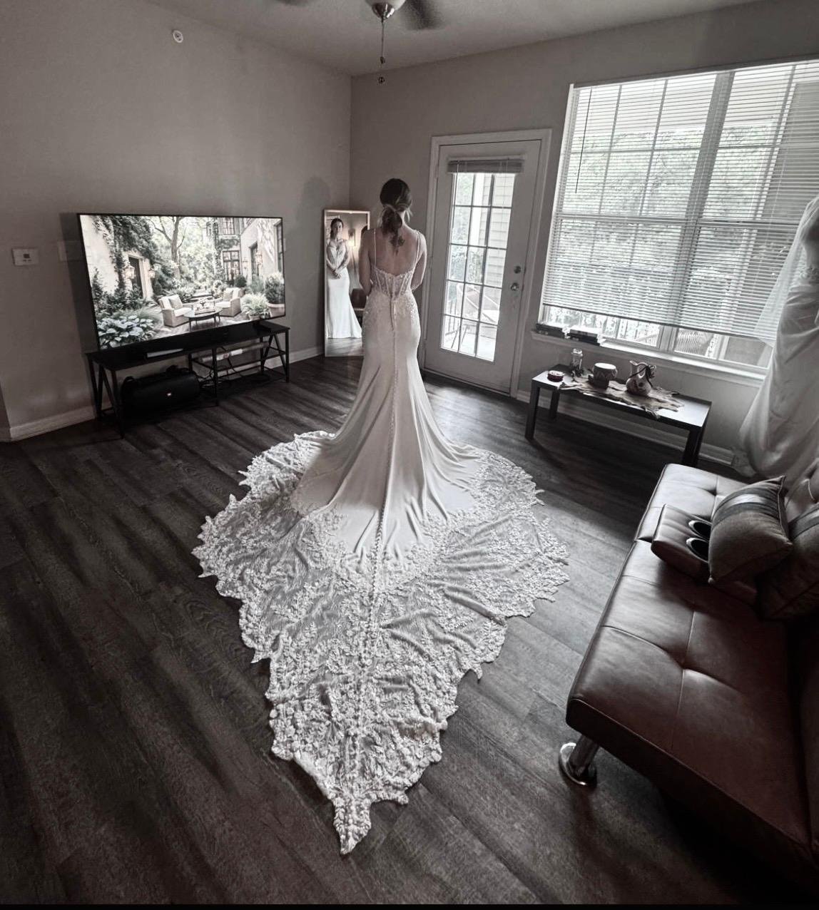 Bride wearing a wedding gown during a professional bridal fitting and alterations appointment