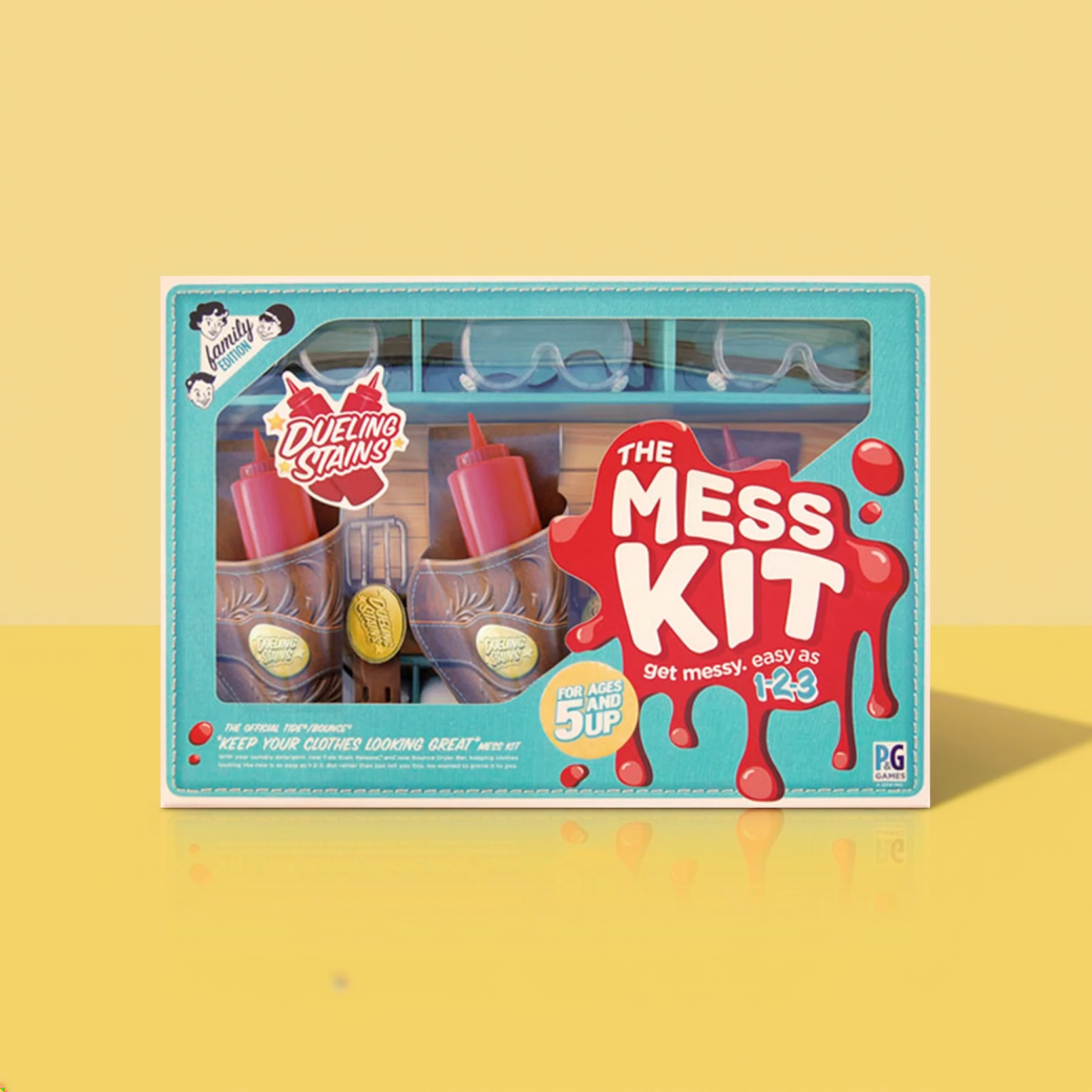 The Mess Kit toy box: two ketchup bottles in gun holsters and three pairs of safety goggles, on a yellow background.