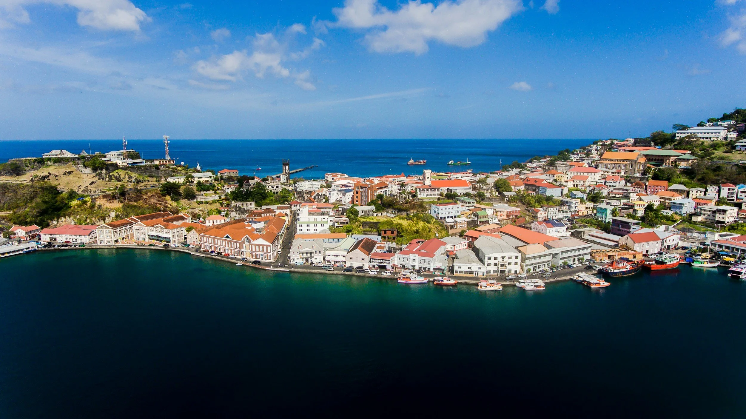Colorful waterfront buildings and harbor in Grenada