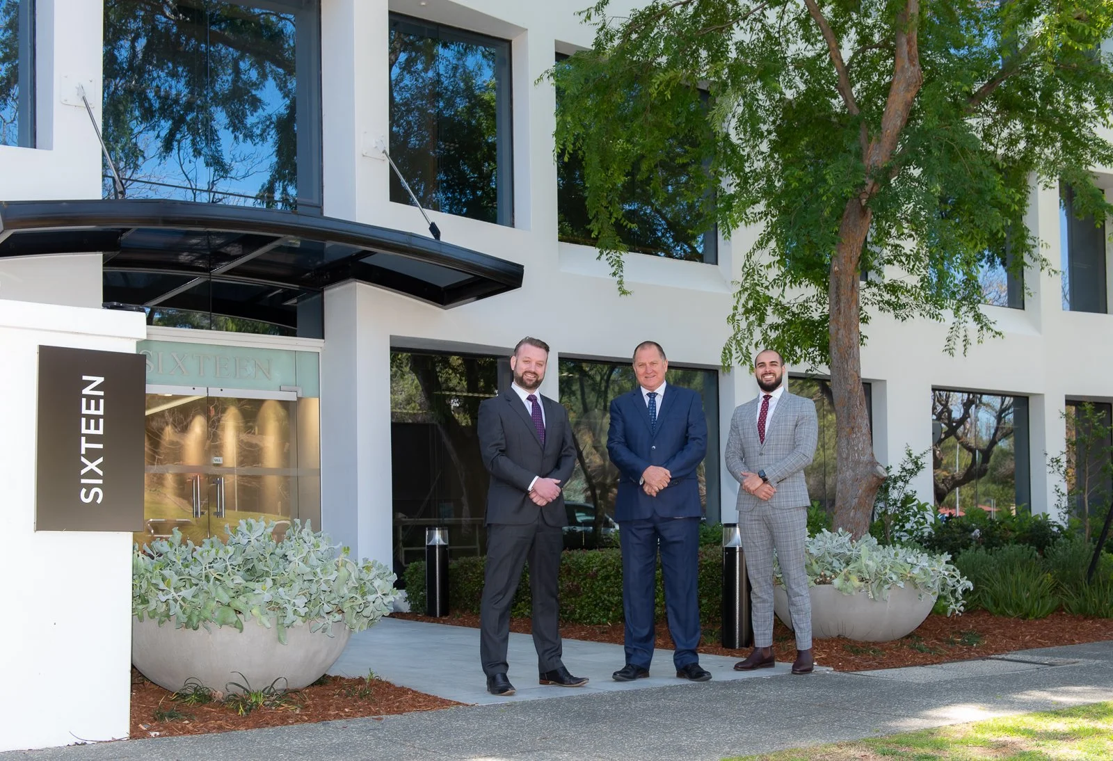 Business team photographed outside a commercial office in Perth