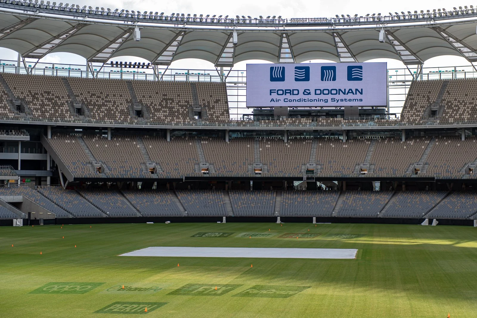 Commercial event branding displayed inside a major Perth stadium