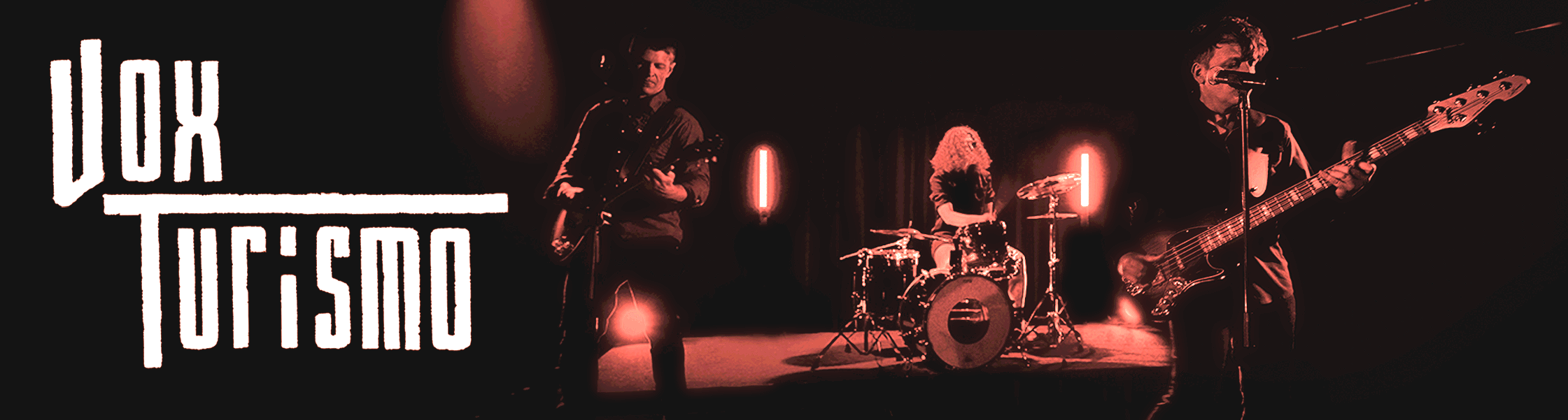 A band performing live on stage with a guitarist, drummer, and bassist under red lighting, with the text 'DUI of SOUND' on the left side.