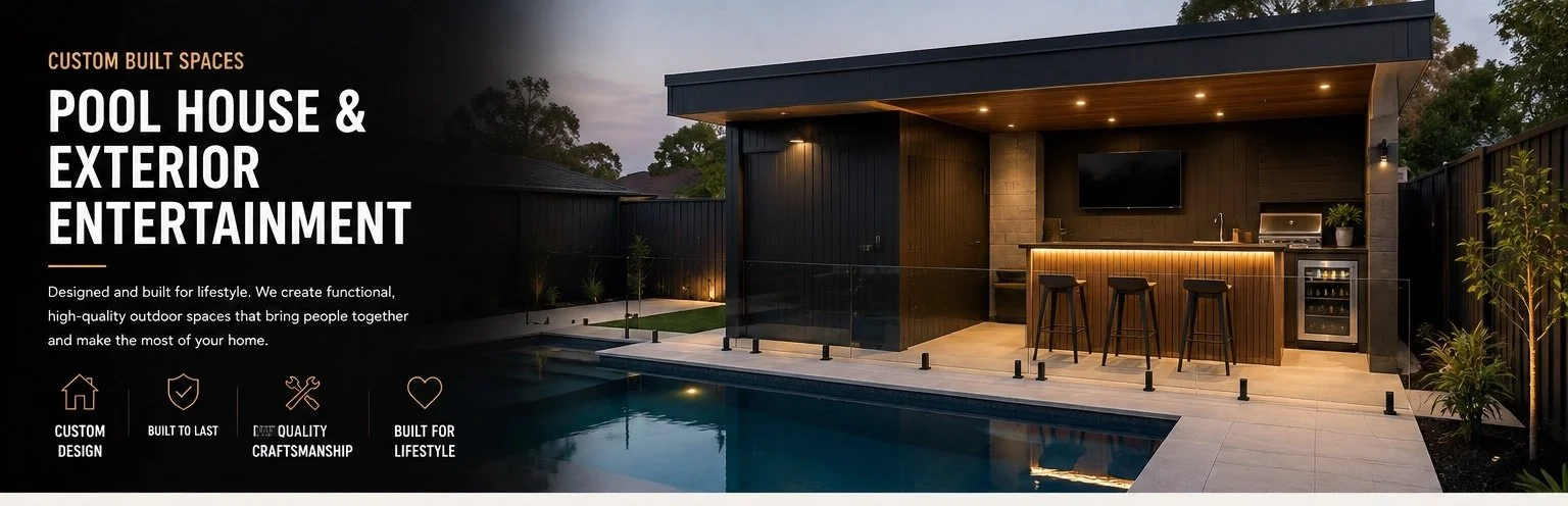 Modern outdoor pool area featuring a pool, a built-in outdoor bar with three stools, a large TV, and exterior lighting, surrounded by a black fence and landscaped with potted plants and trees.