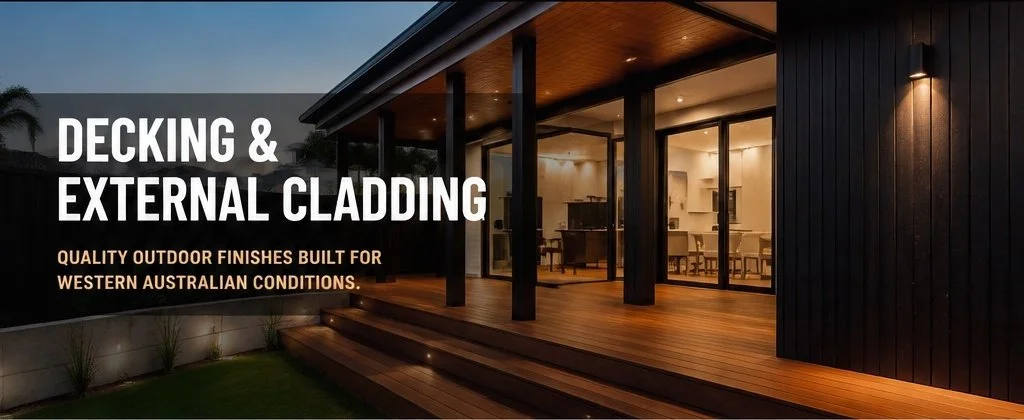 A modern house exterior with a wooden deck and sliding glass doors, illuminated by outdoor lighting, promoting decking and external cladding for Western Australian conditions.