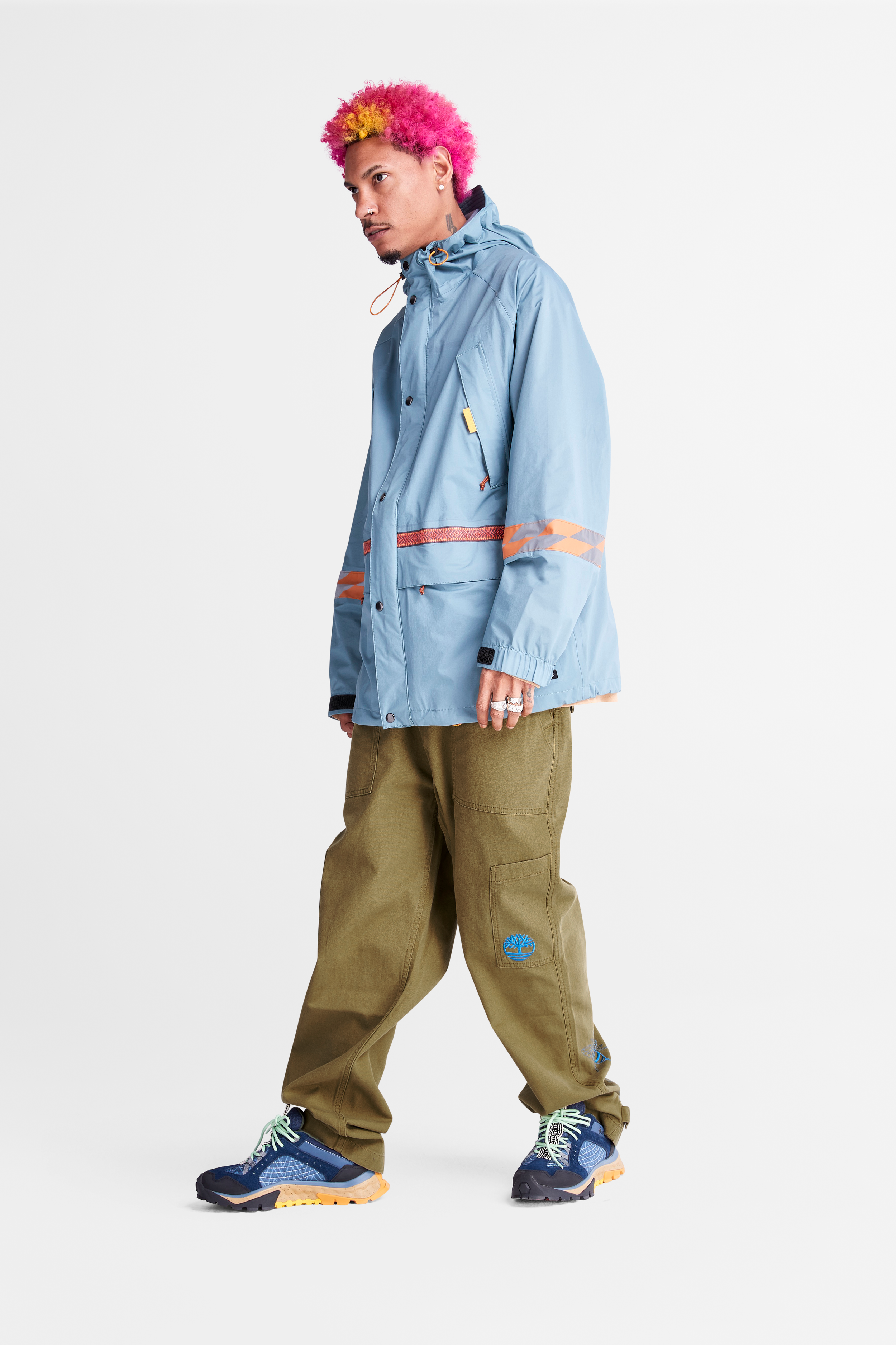 Model in Timberland x Bee Line by Billionaire Boys Club jacket, pants and hiking boots