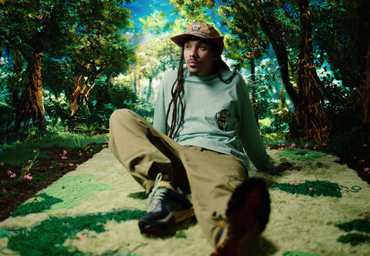 Surreal Timberland x Bee Line campaign still of a figure seated in a green-lit forest