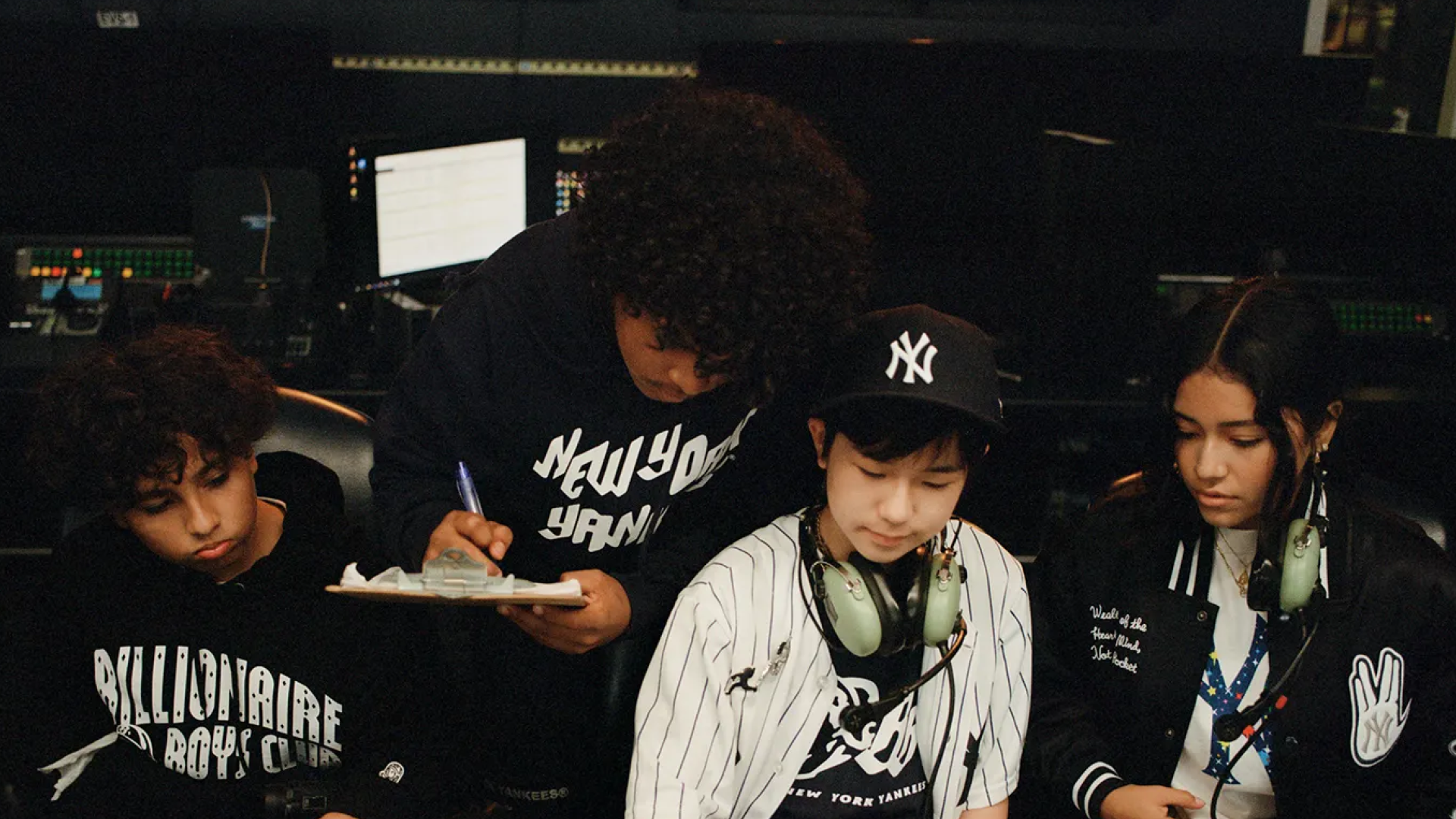 Young fans in New York Yankees x Billionaire Boys Club apparel signing autographs