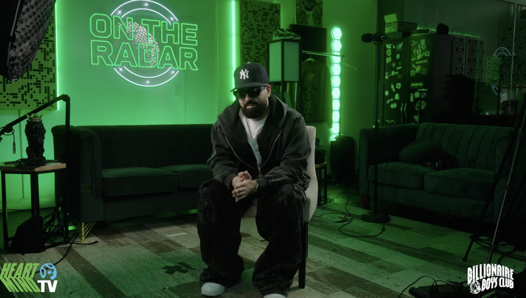 Artist seated on the On the Radar x Billionaire Boys Club studio set