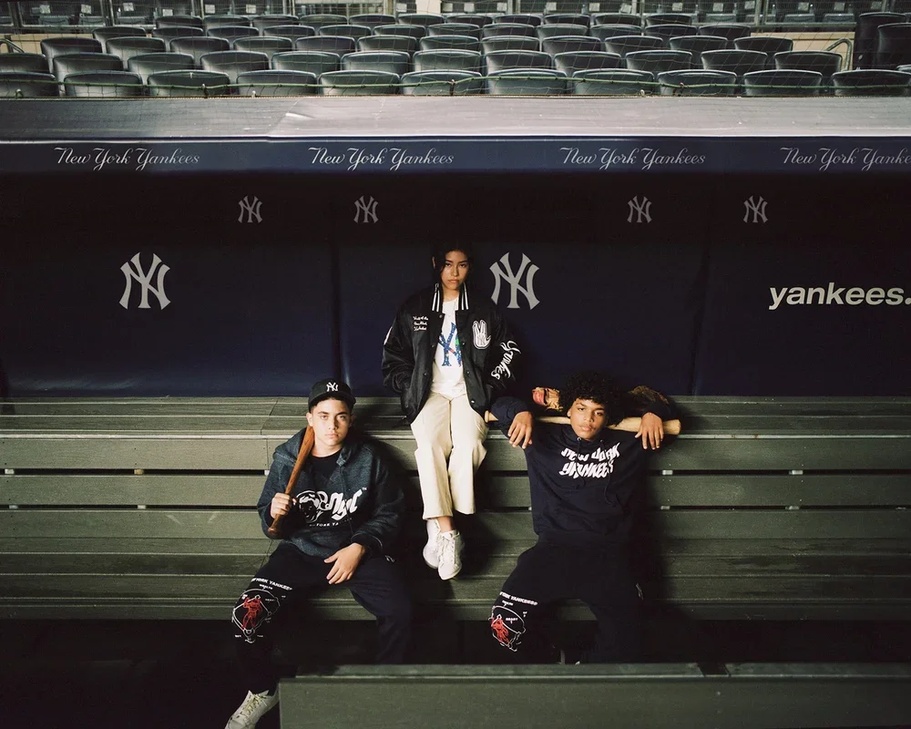 Campaign models posed in the Yankee Stadium stands for the New York Yankees x Billionaire Boys Club outdoor ads