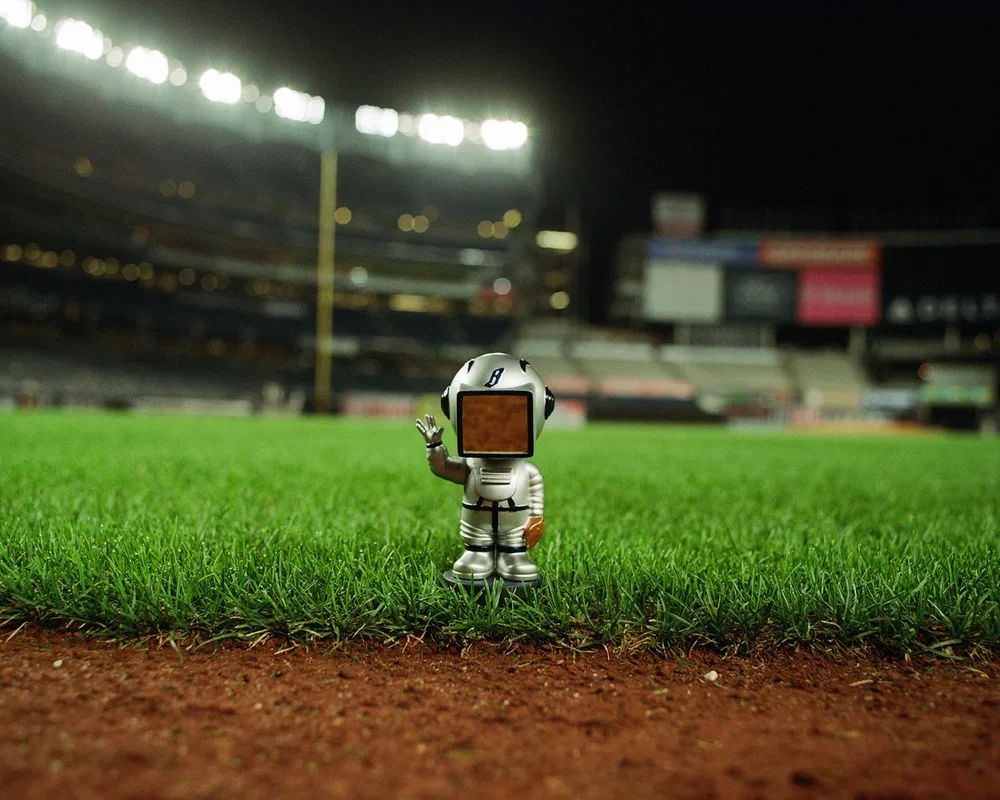 Billionaire Boys Club astronaut figure on the Yankee Stadium infield for the collaboration campaign