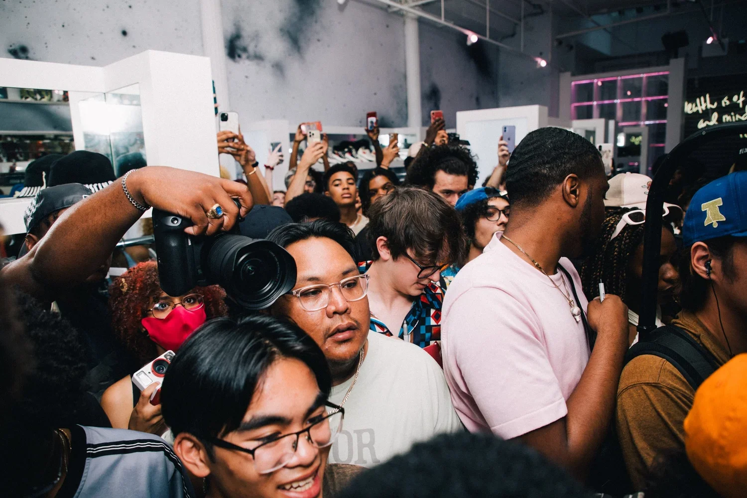 Crowd of fans filming on their phones at the ICECREAM x Smino launch event