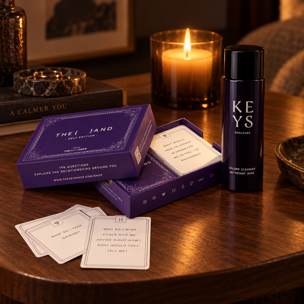 Keys Soulcare products bundled with The Skin Deep conversation cards beside a lit candle