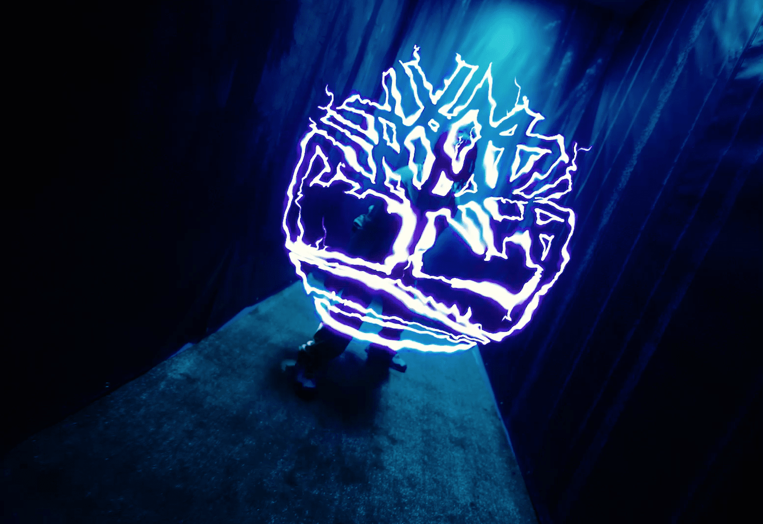 Glowing Timberland tree logo drawn in light for the Timberland x Bee Line collaboration