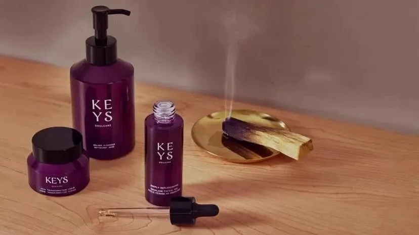Keys Soulcare skincare products arranged on a wooden surface