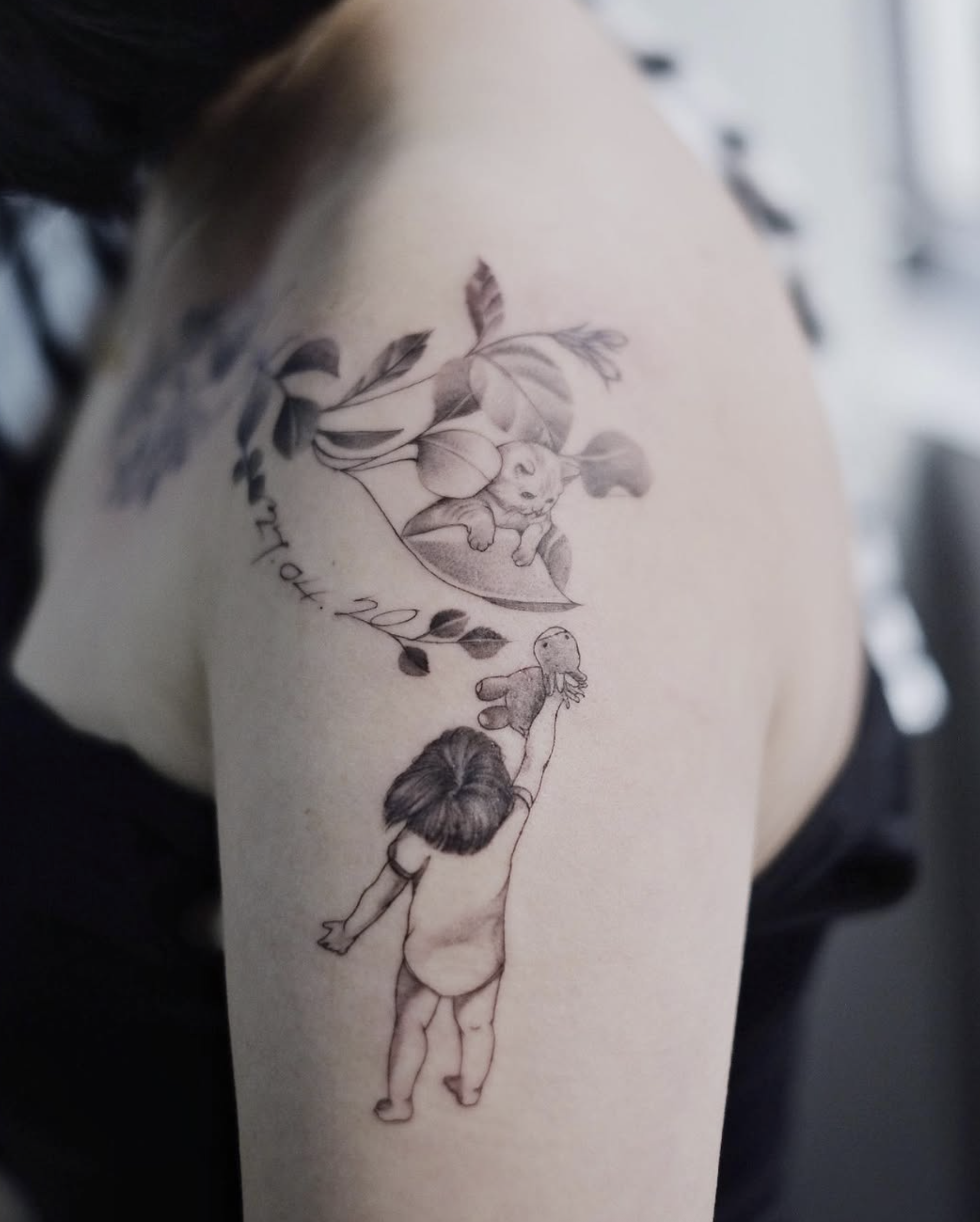 Tattoo of a girl with long hair holding a teddy bear, with leaves and flowers surrounding her, on a person's arm.