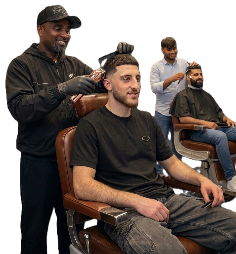 Barber cutting a man's hair at a barbershop, with another customer getting a haircut in the background.