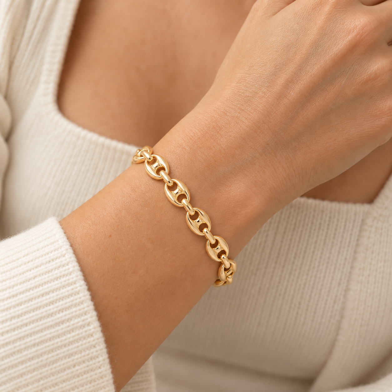 Slim gold mariner bracelet on wrist.png