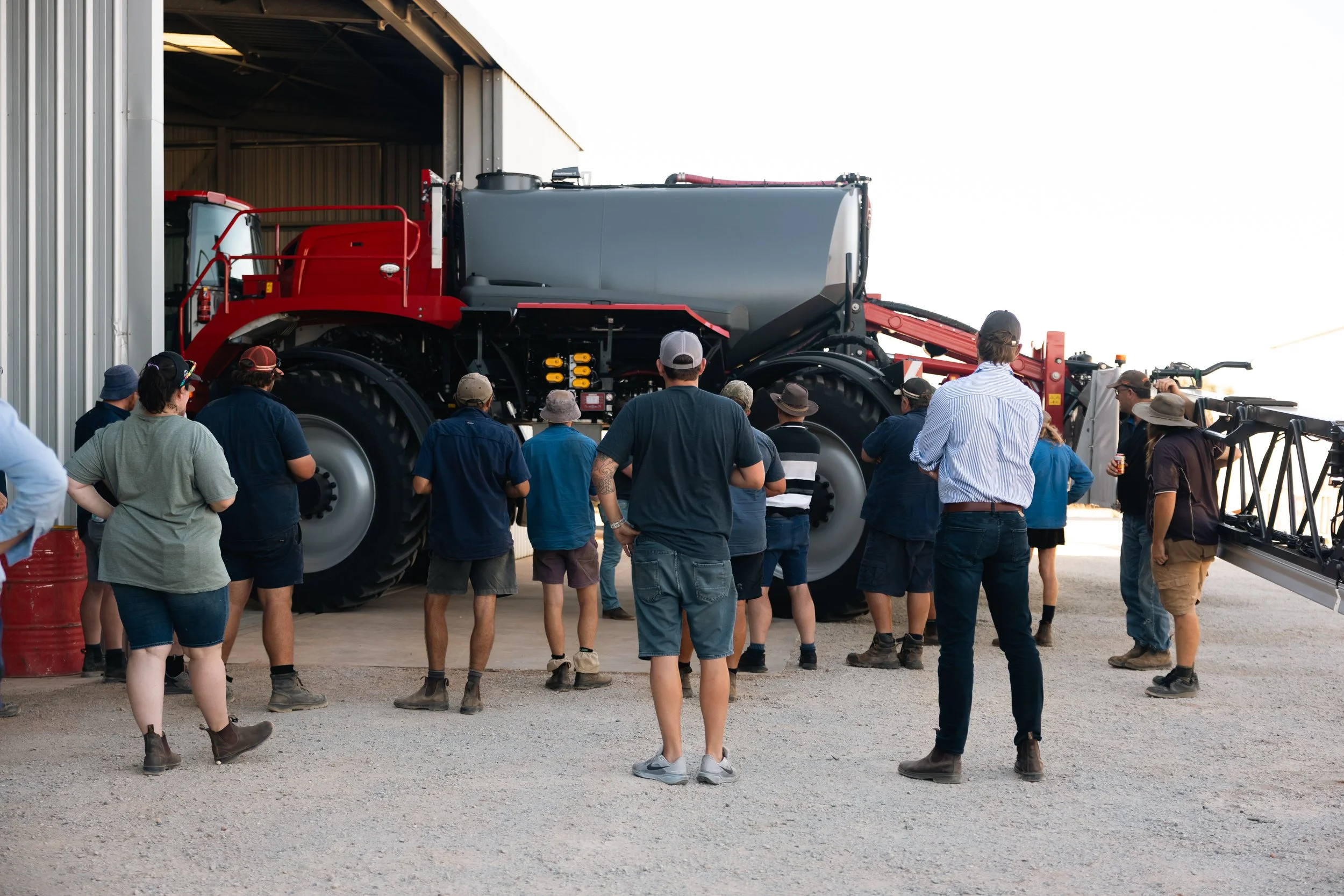 Growers gathered around a HORSCH sprayer at a CNE Ag Innovations demo day
