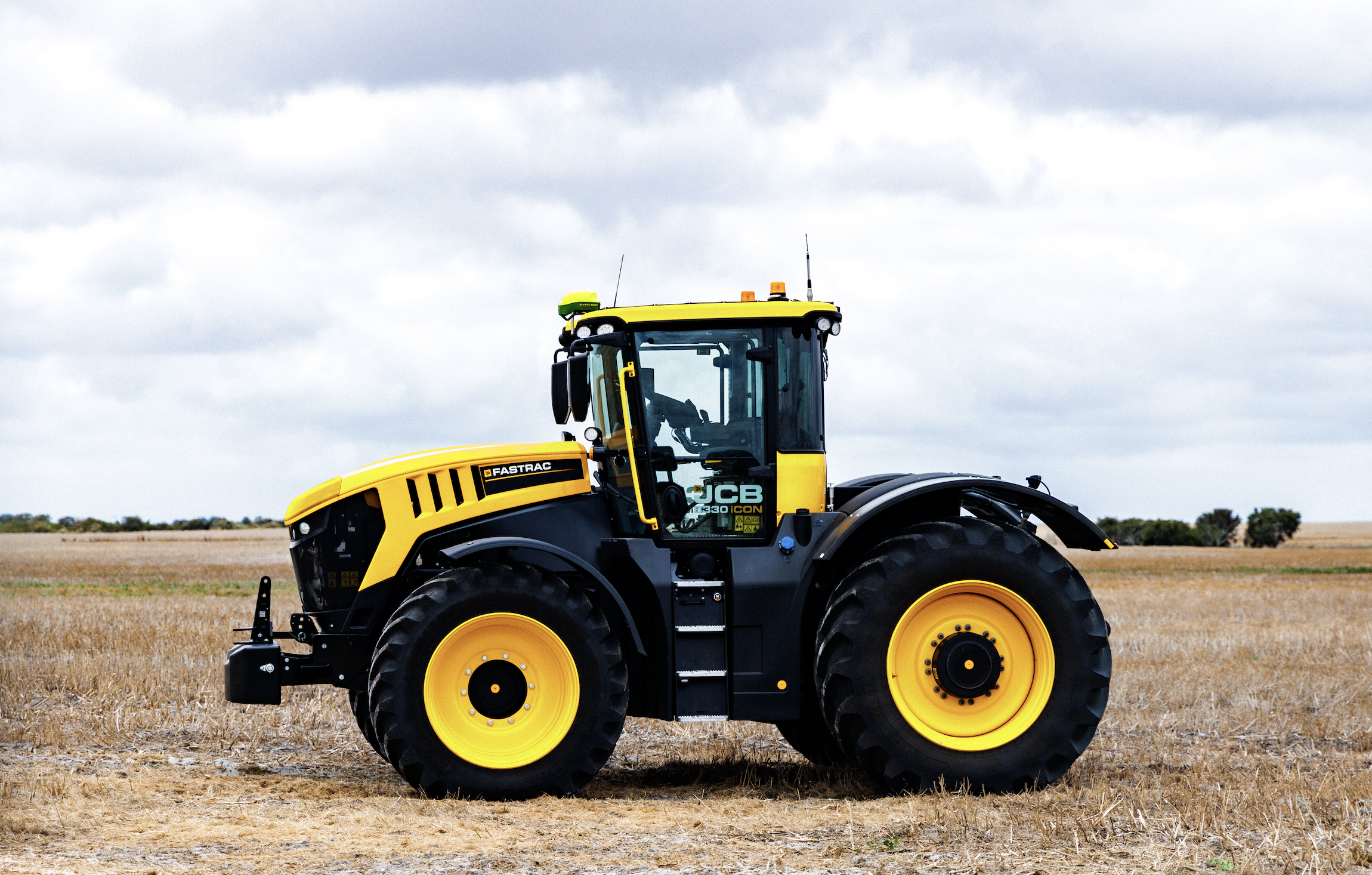 JCB Fastrac tractor parked in a harvested paddock