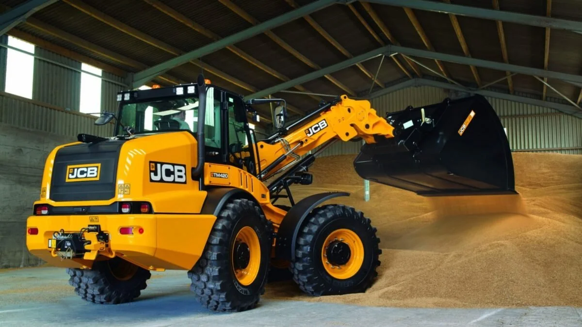 JCB telescopic wheel loader working in a grain shed