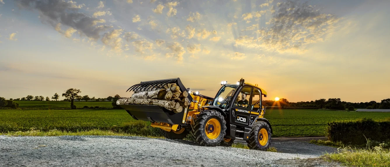 JCB 536-95 Agri telehandler with a high-volume shovel at sunset