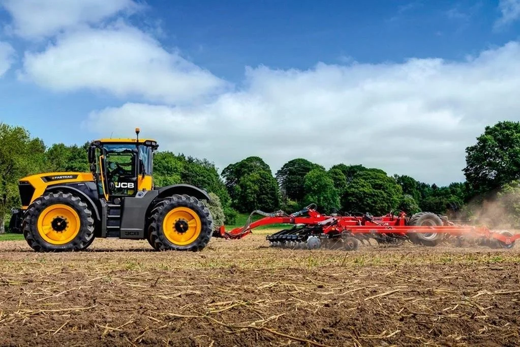 JCB Fastrac 6300 tractor pulling a cultivator across a paddock
