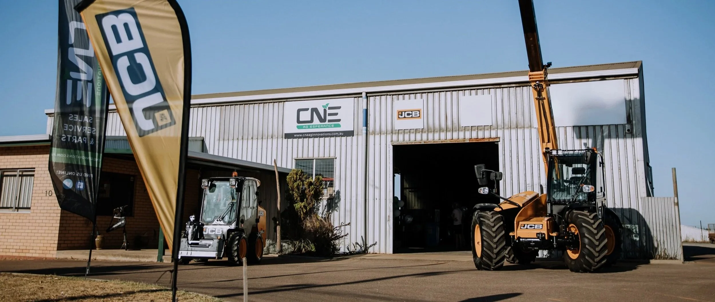 CNE Ag Innovations Esperance dealership with JCB flags and a telehandler