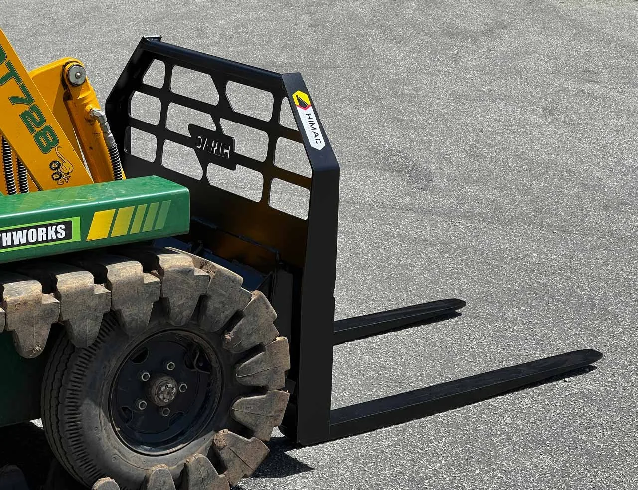 HIMAC sliding tyne pallet forks on a mini loader