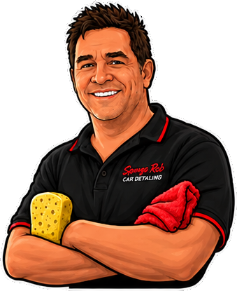 Rob with his arms crossed, holding a sponge