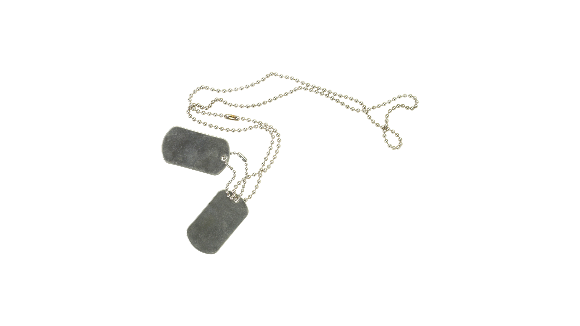 A silver metal dog tag necklace with two attached tags, lying on a black background.