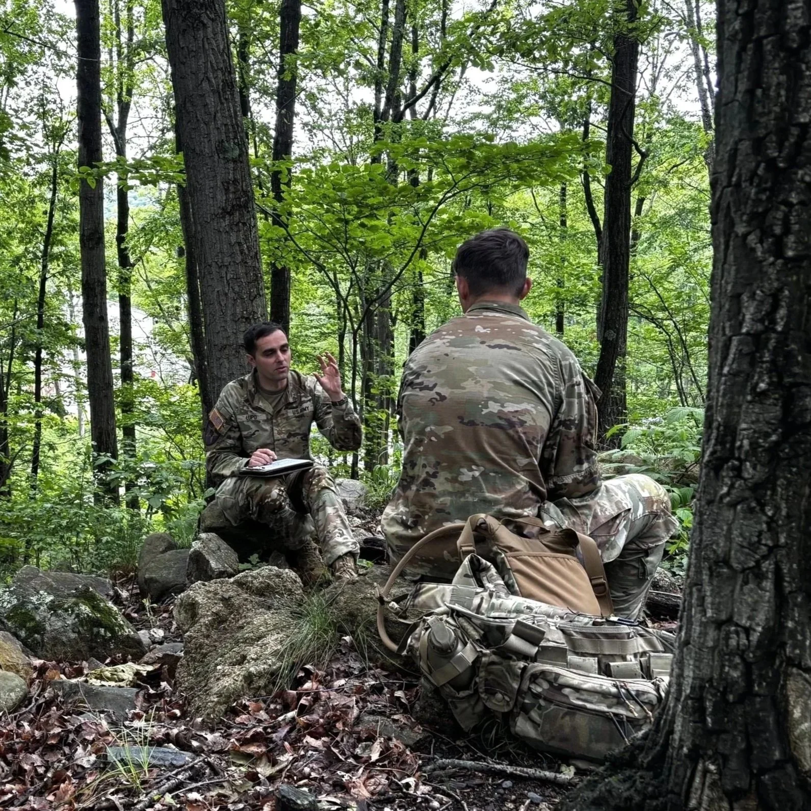 A Moral Terrain Coach conducts a coaching session in the field at West Point, NY.