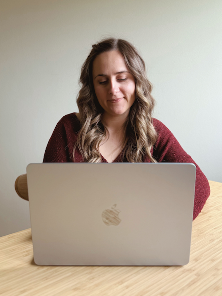 Kat, founder of Mellow Office, working at her laptop.