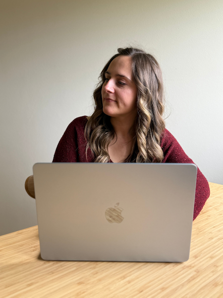 Kat, founder of Mellow Office, working at her laptop.