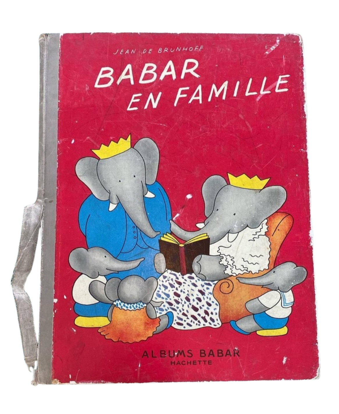 Vintage children's book cover titled "Babar en Famille" showing two elephants wearing coronets, reading a book together, with one sitting on a chair and the other on the floor.