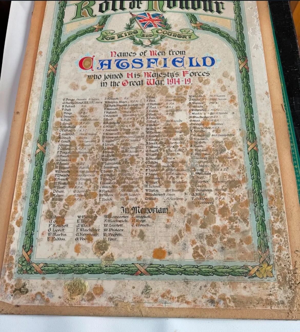 A weathered, stained historical military enlistment poster listing names of men from Hasfield who joined King's Majesty's Forces in the Great War 1914-19, decorated with green border, Union Jack at the top, and decorative illustrations.