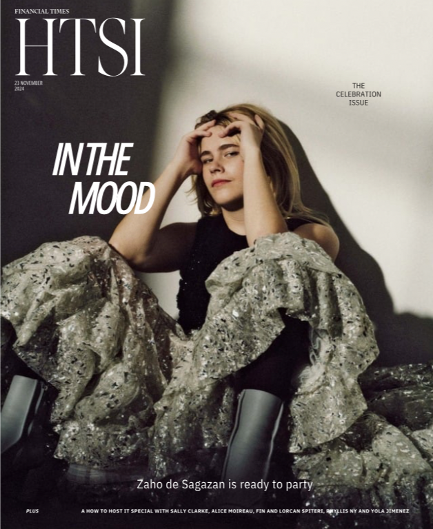 Cover of Financial Times' HITSI magazine, issue dated November 23, 2024, titled 'In the Mood.' Features a young woman sitting with her hands on her head, wearing a black top and patterned skirt, with a shadow cast on the wall behind her.