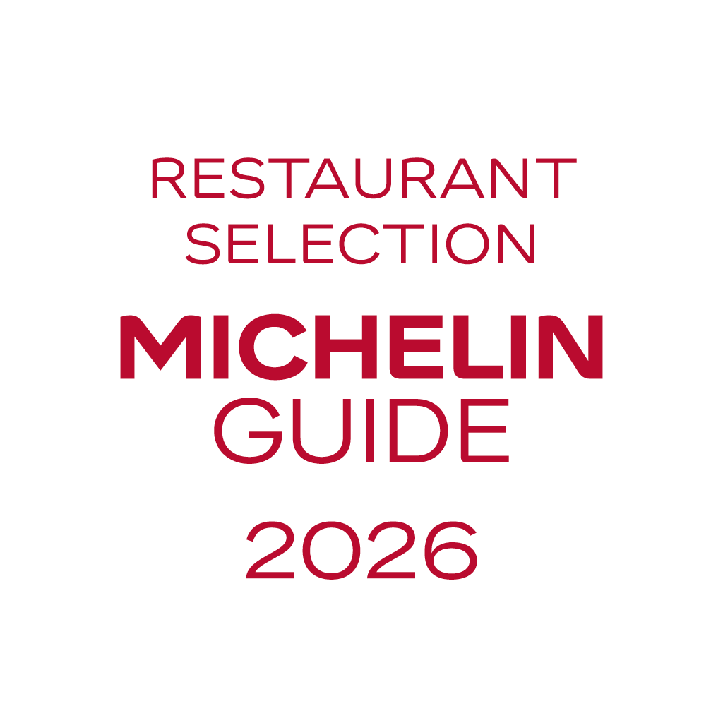 Forside av Michelins restaurantguide for 2026, med teksten "Restaurant Selection Michelin Guide 2026" i rødt på hvit bakgrunn.
