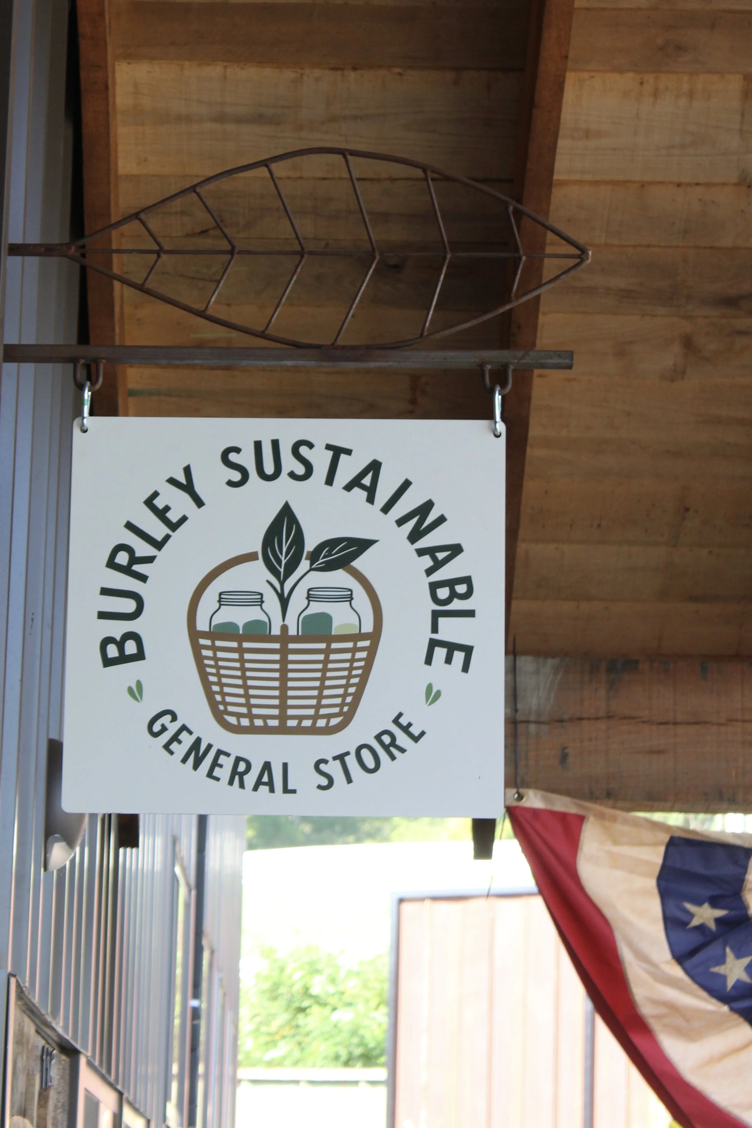 Outdoor sign at Burley Sustainable General Store in West Jefferson, NC.