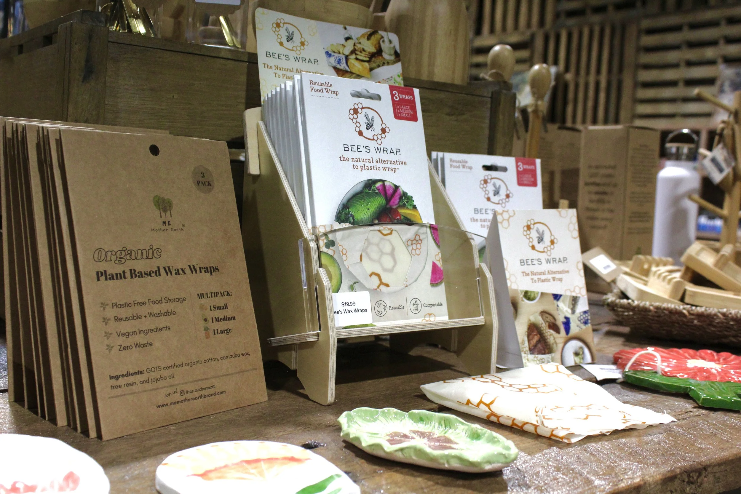 Biodegradable beeswax food wraps in a store with various eco-friendly product packaging at Burley Sustainable General Store in West Jefferson, NC.