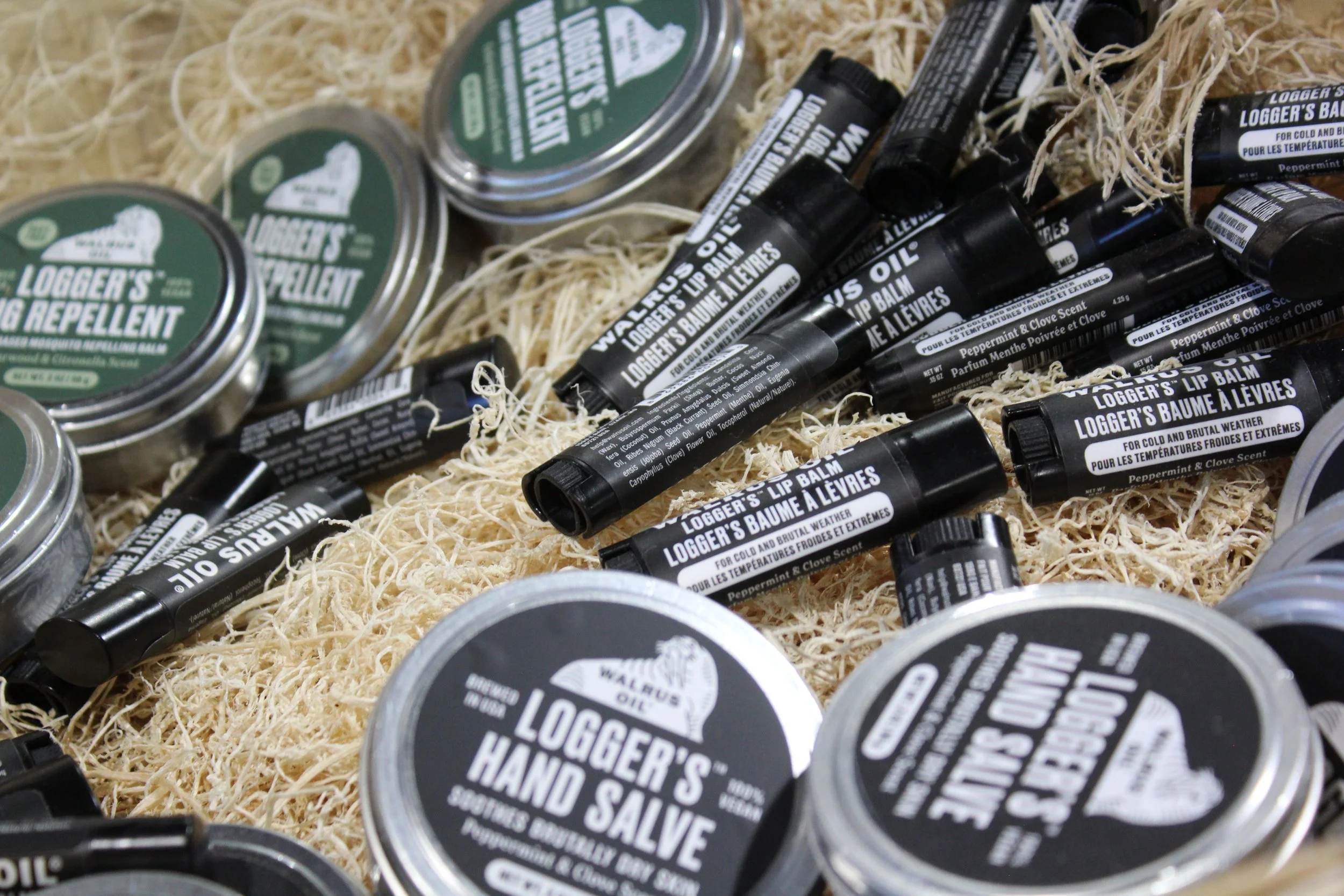 Various containers and tubes of Logger's Hand Salve and logger's lip balm at Burley Sustainable General Store in West Jefferson, NC.
